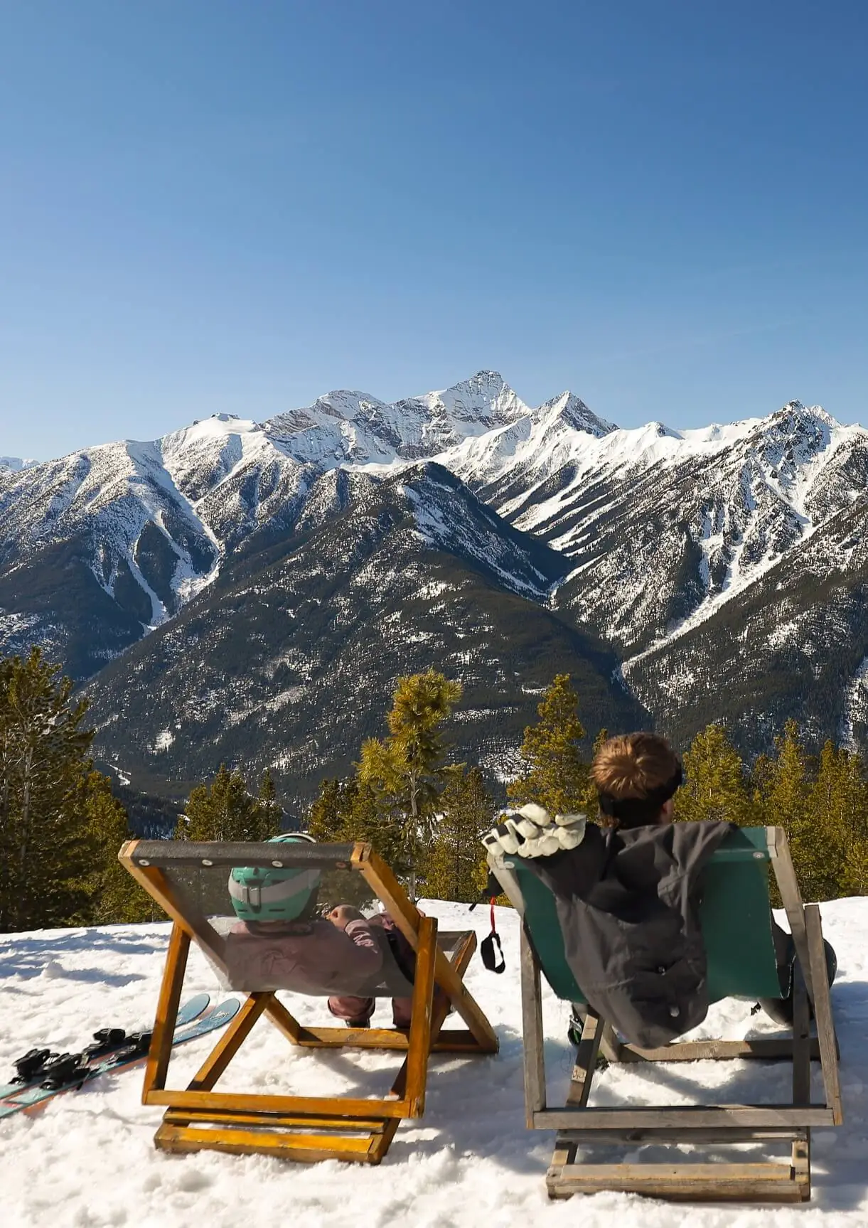 People on deck chairs at panorama mountain resort in spring